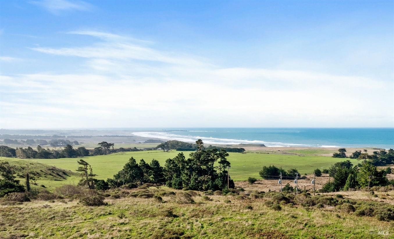 an aerial view of ocean with beach