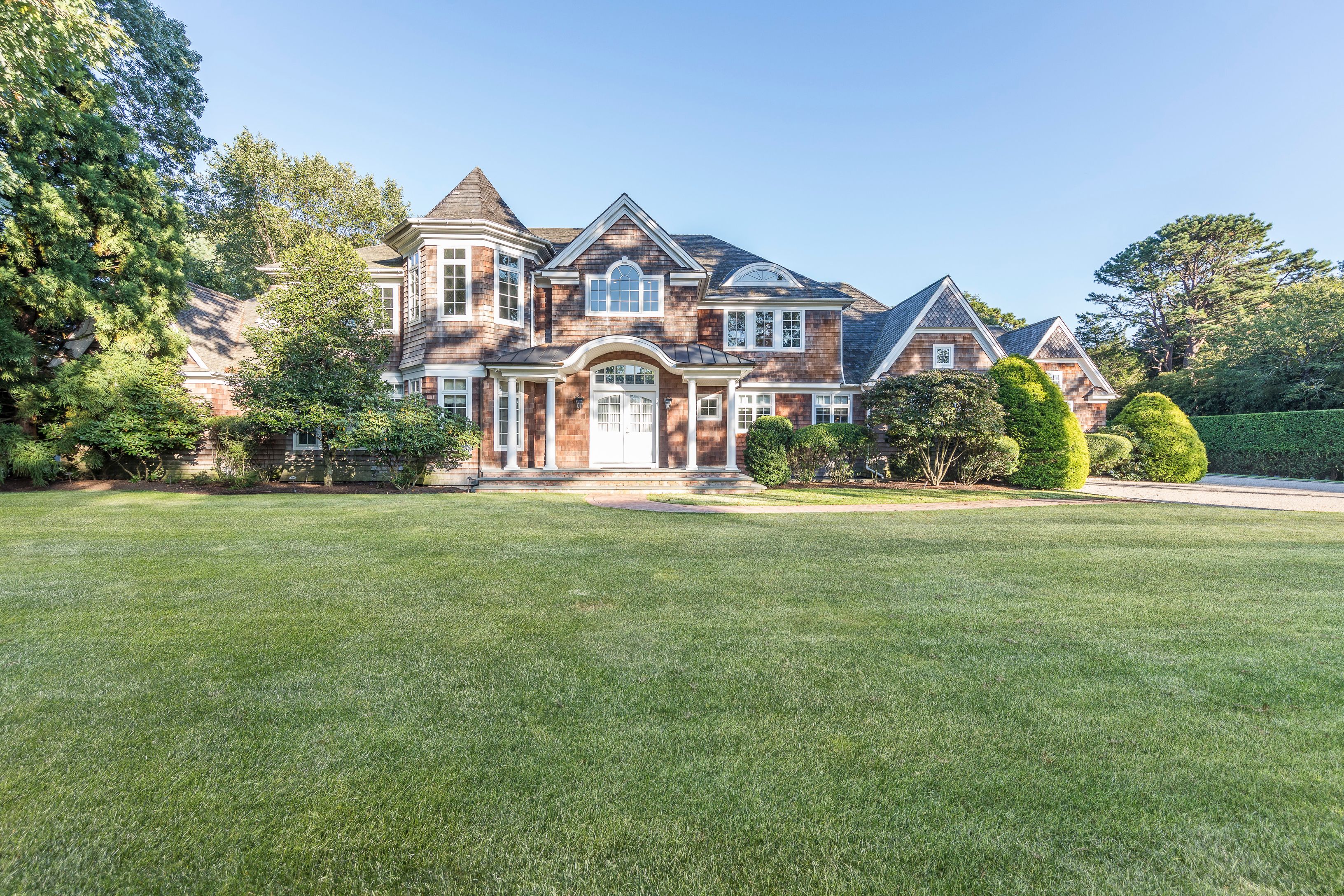 a front view of a house with garden