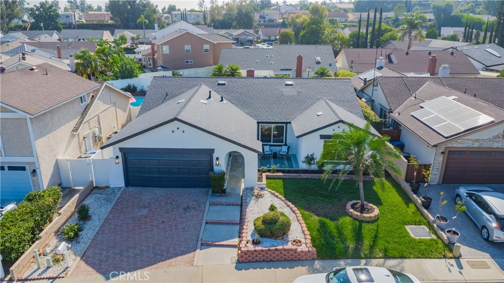 an aerial view of a house with swimming pool