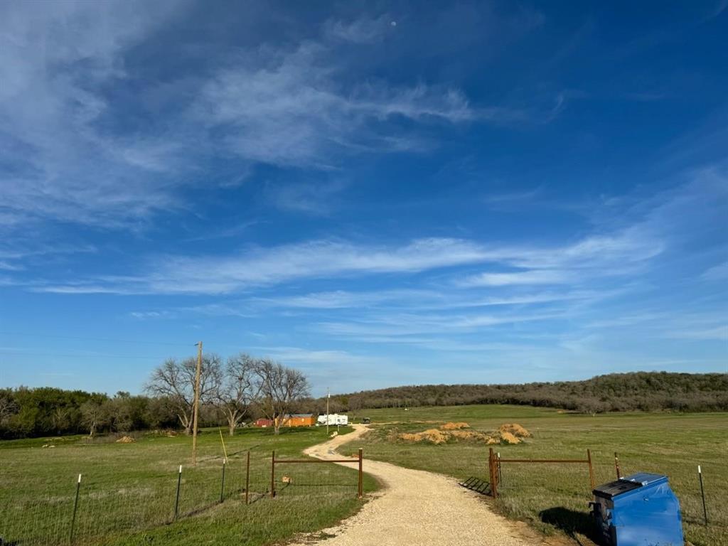 a view of a lake with houses in the background