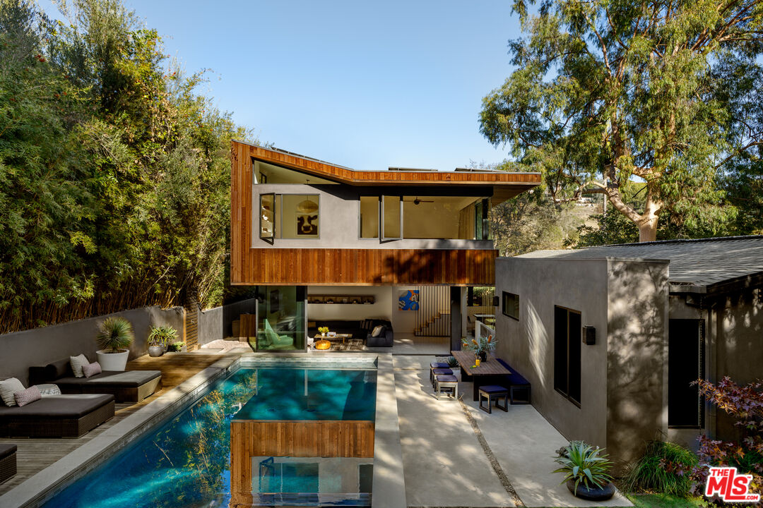 a view of house with outdoor seating