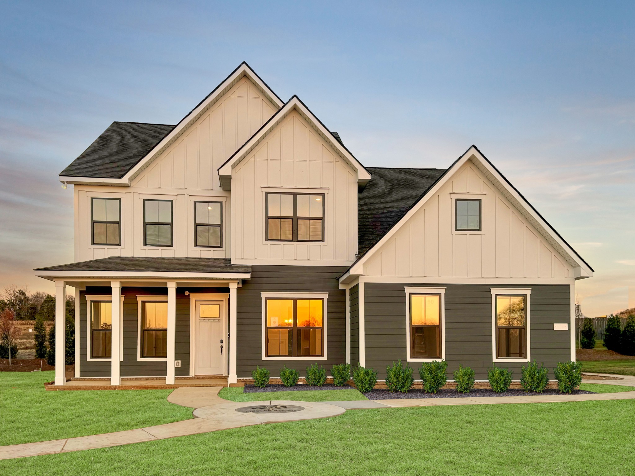 front view of a house with a yard