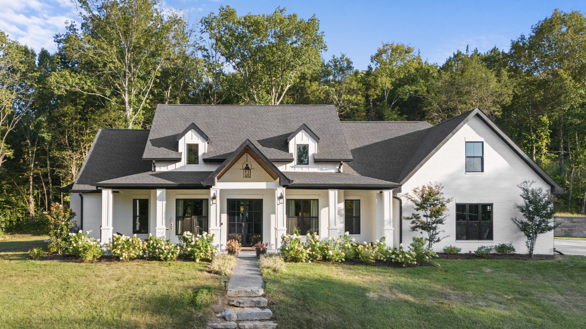 a front view of a house with a yard