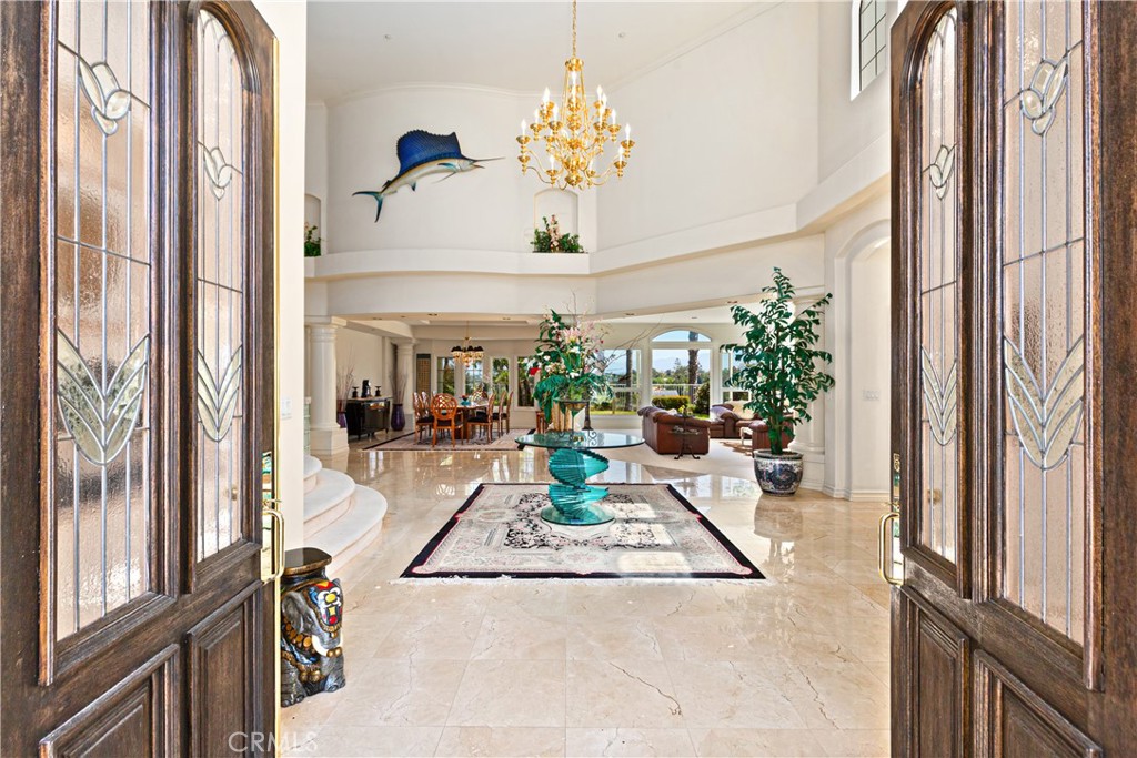 a view of living room with furniture and a chandelier