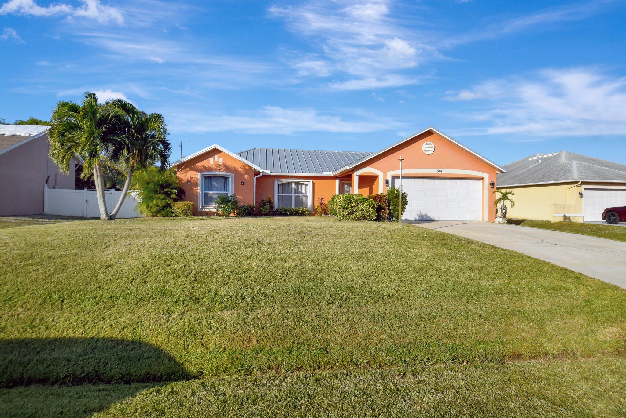 a front view of a house with a yard