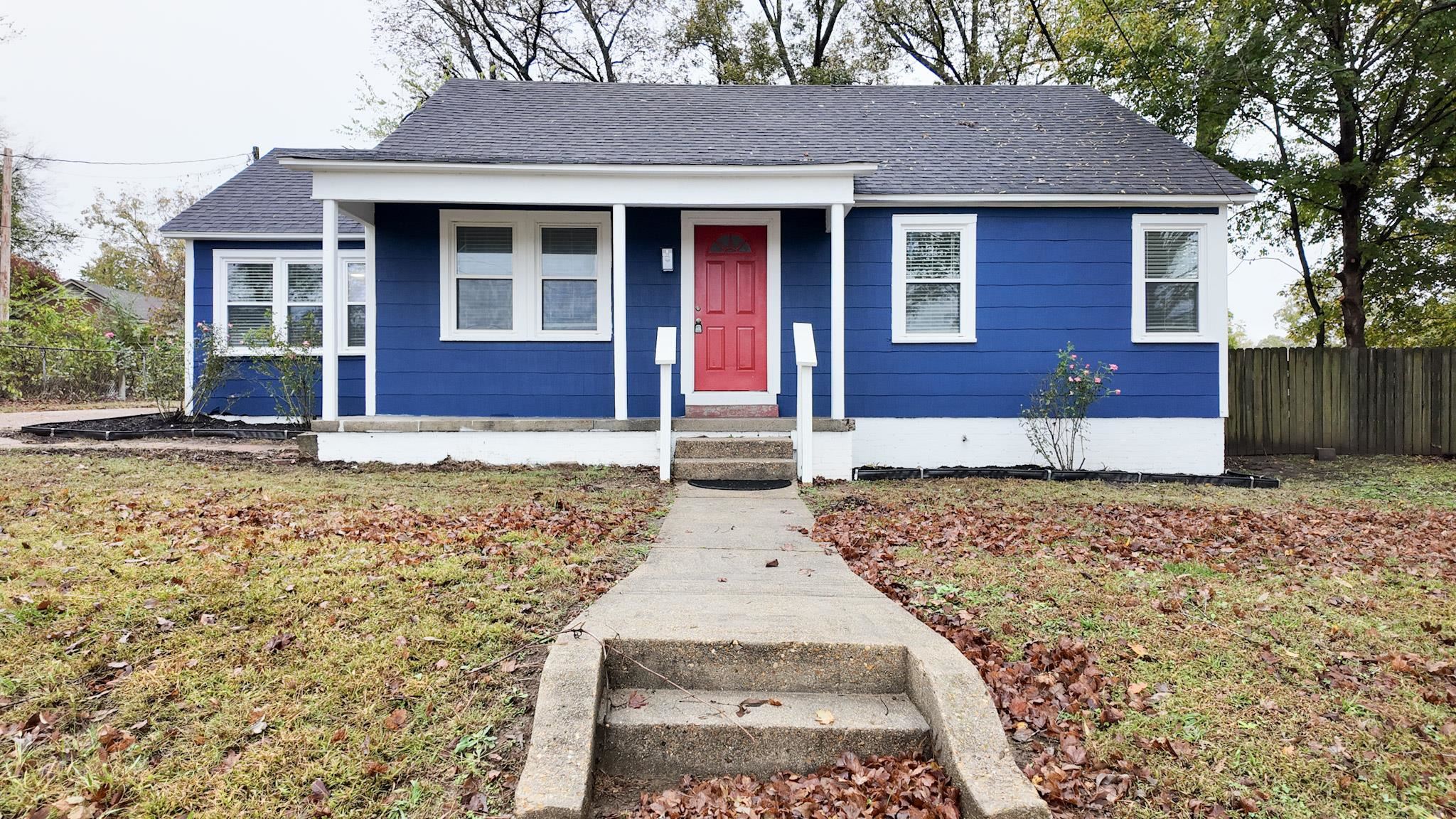 a view of house with yard