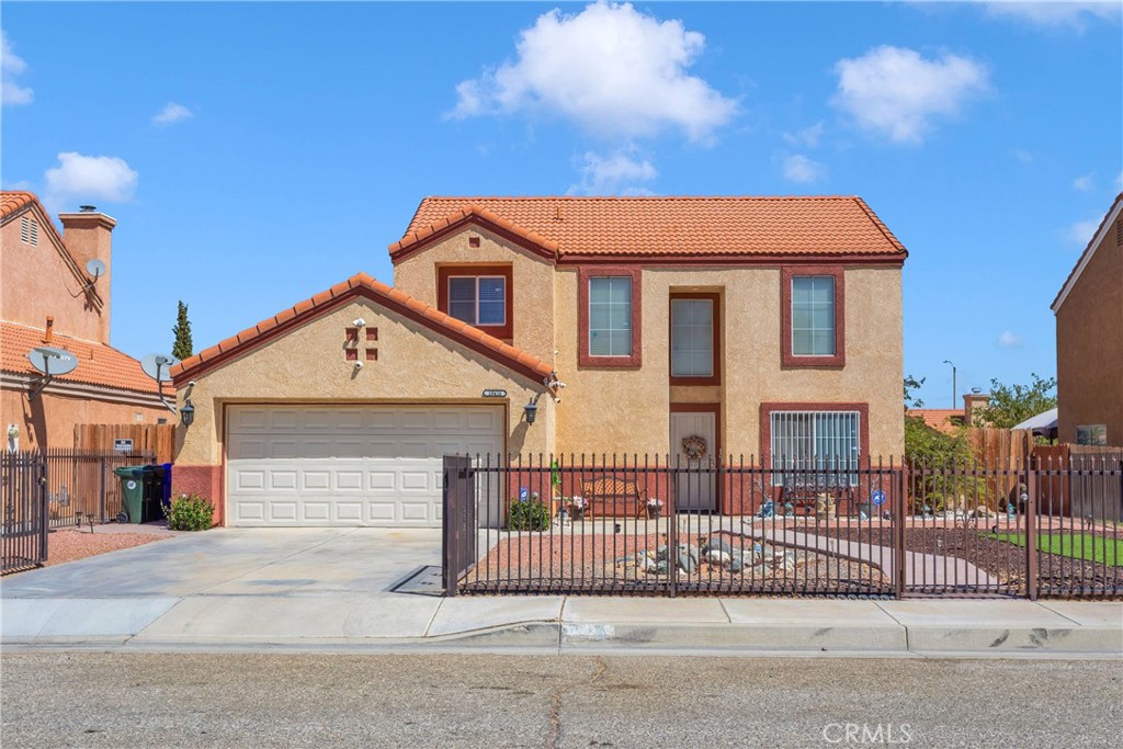 a front view of a house with a fence