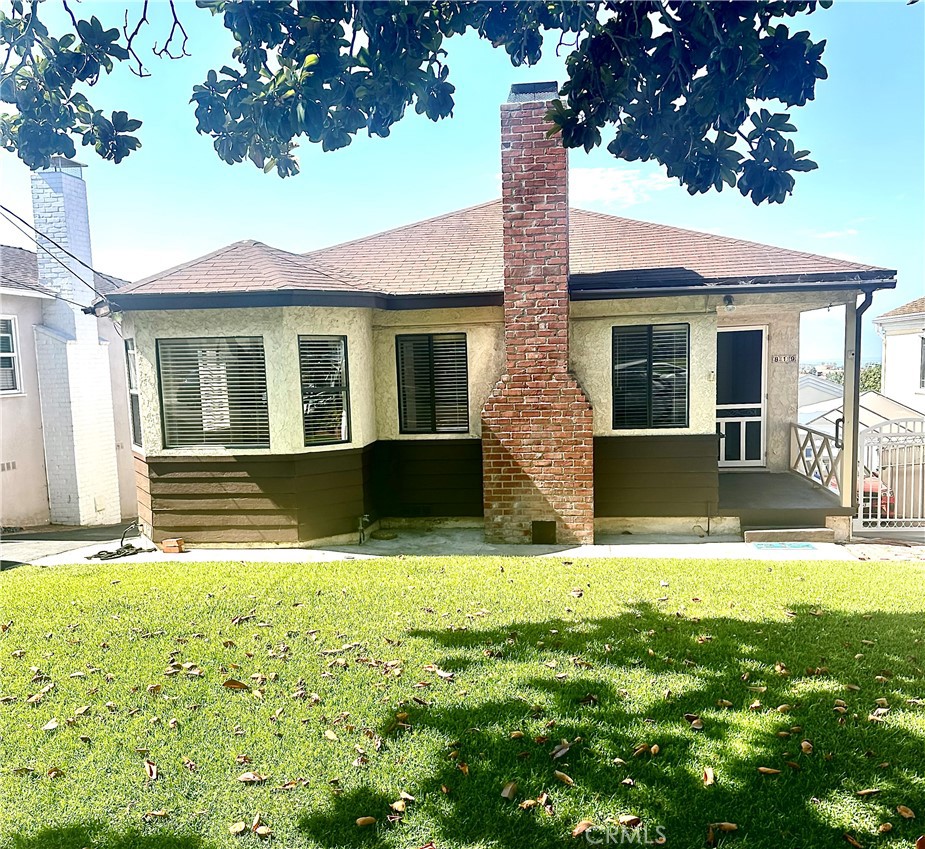 a view of house with yard