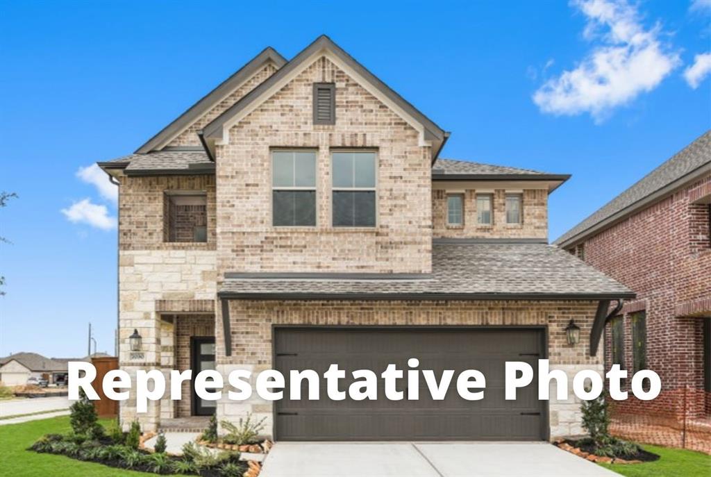 a front view of a house with a garage