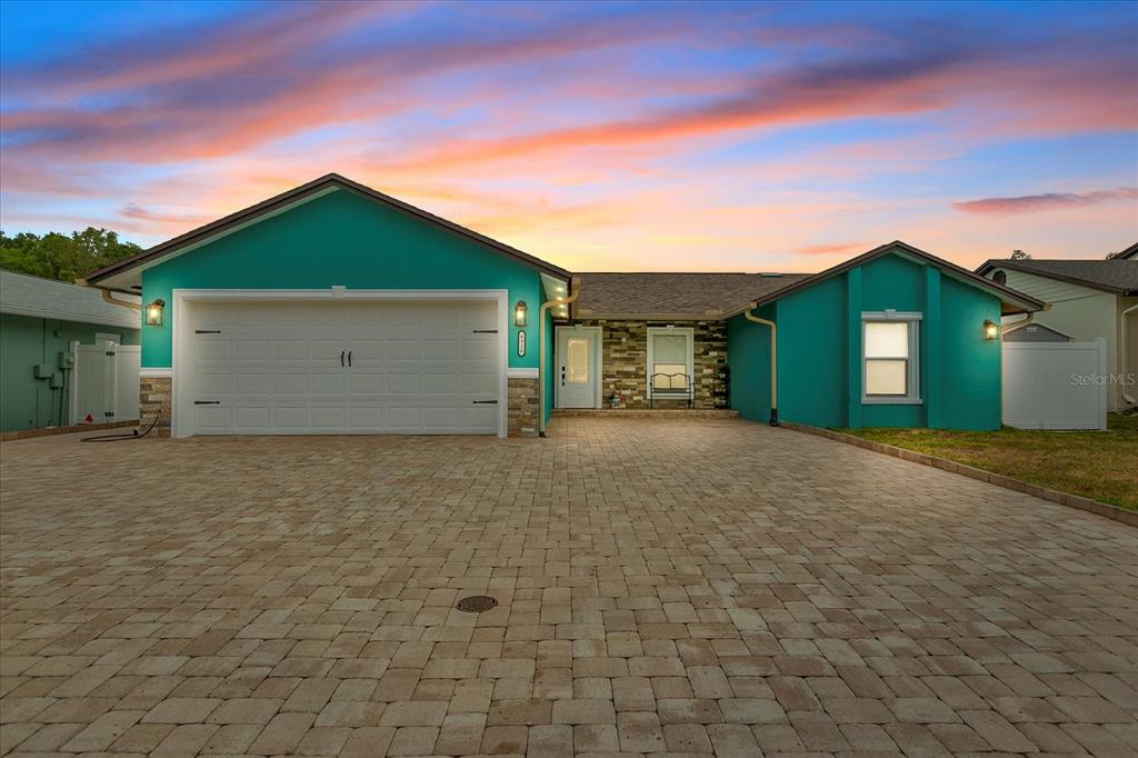 a front view of house with garage and yard