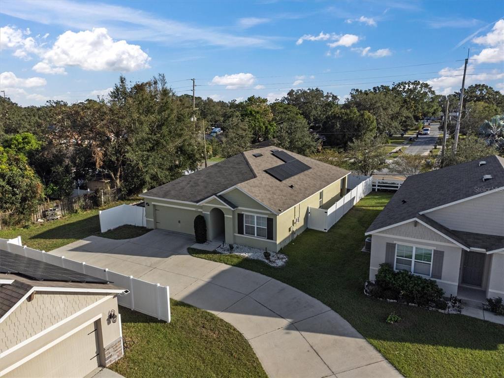 a aerial view of a house with a yard