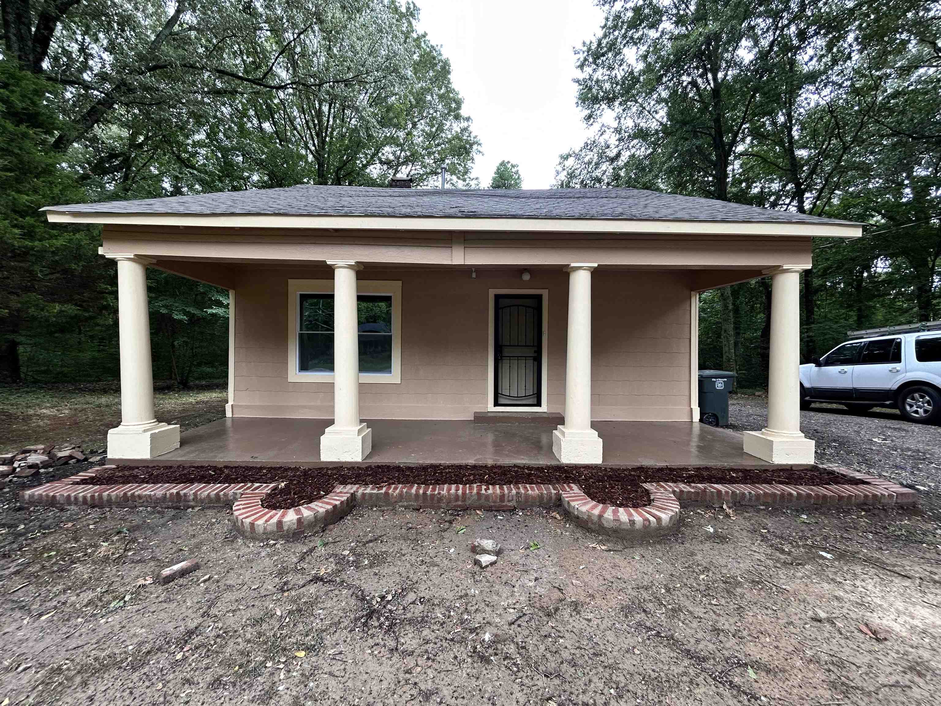 a front view of a house with a yard