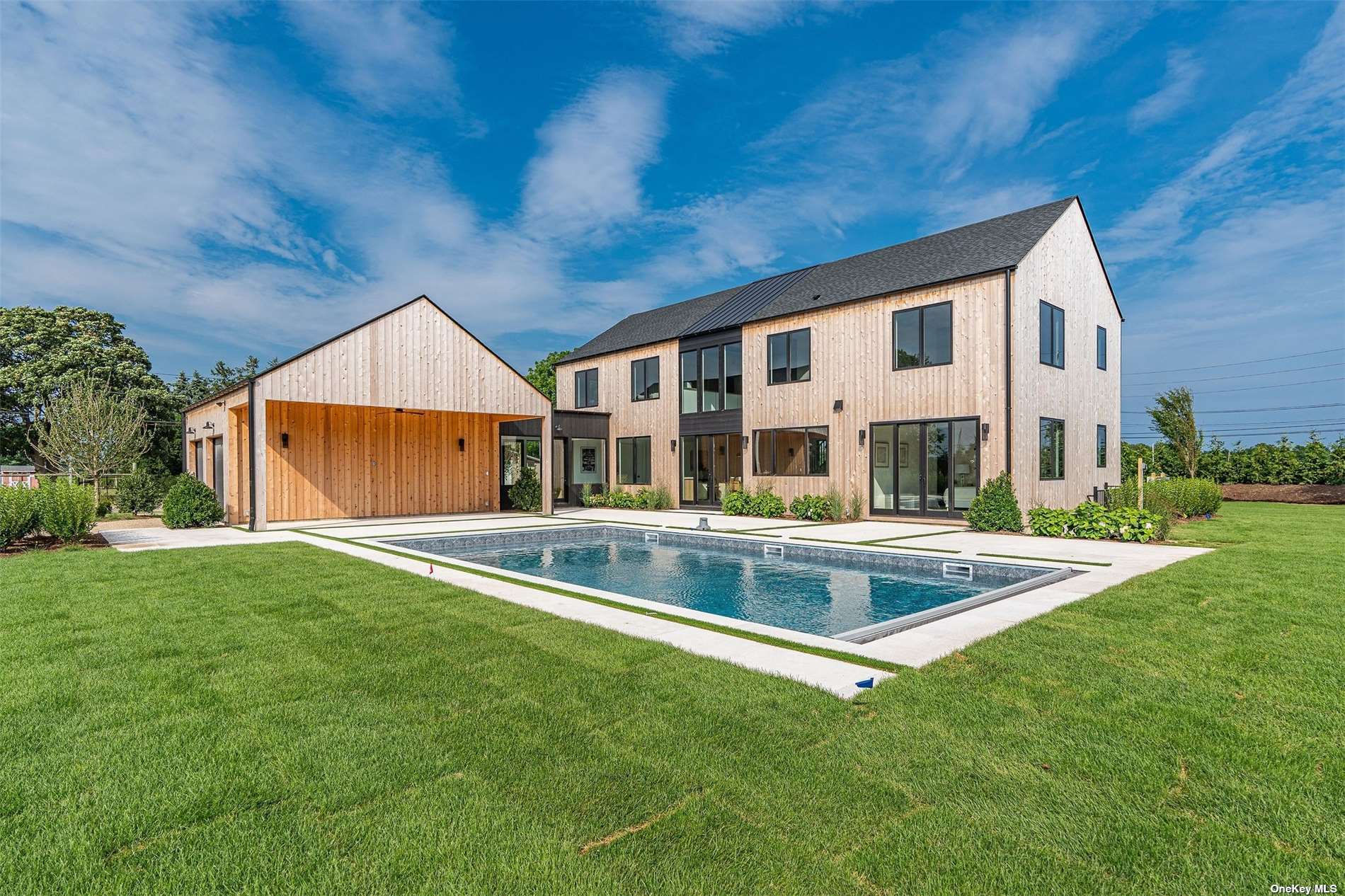 a view of house with a swimming pool