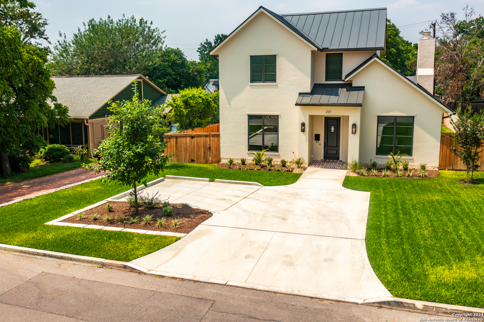 a front view of house with yard and green space