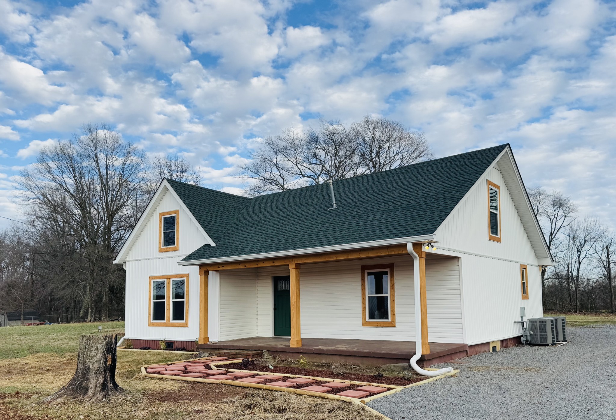 a front view of a house with garden