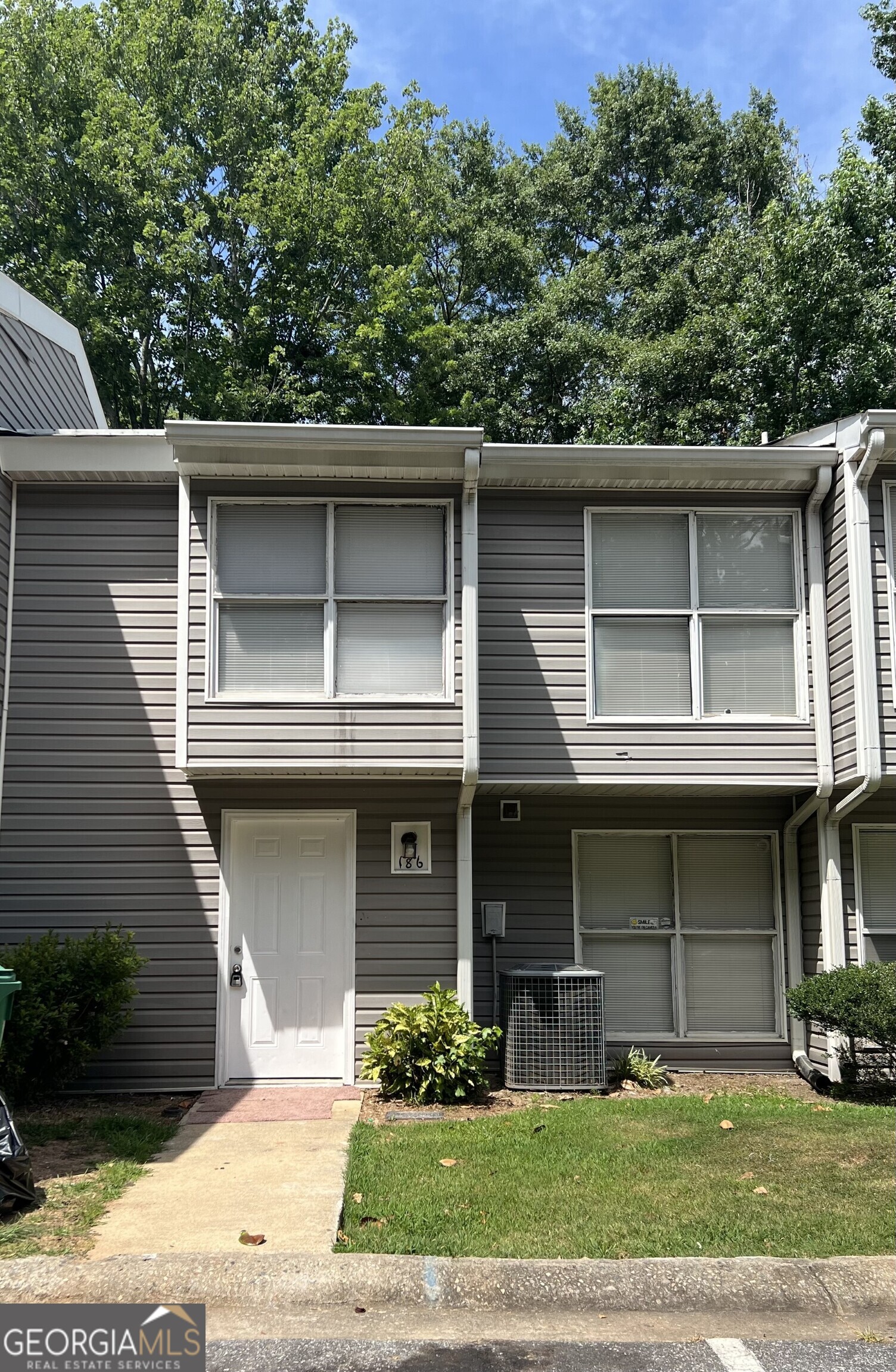 a front view of a house with garage