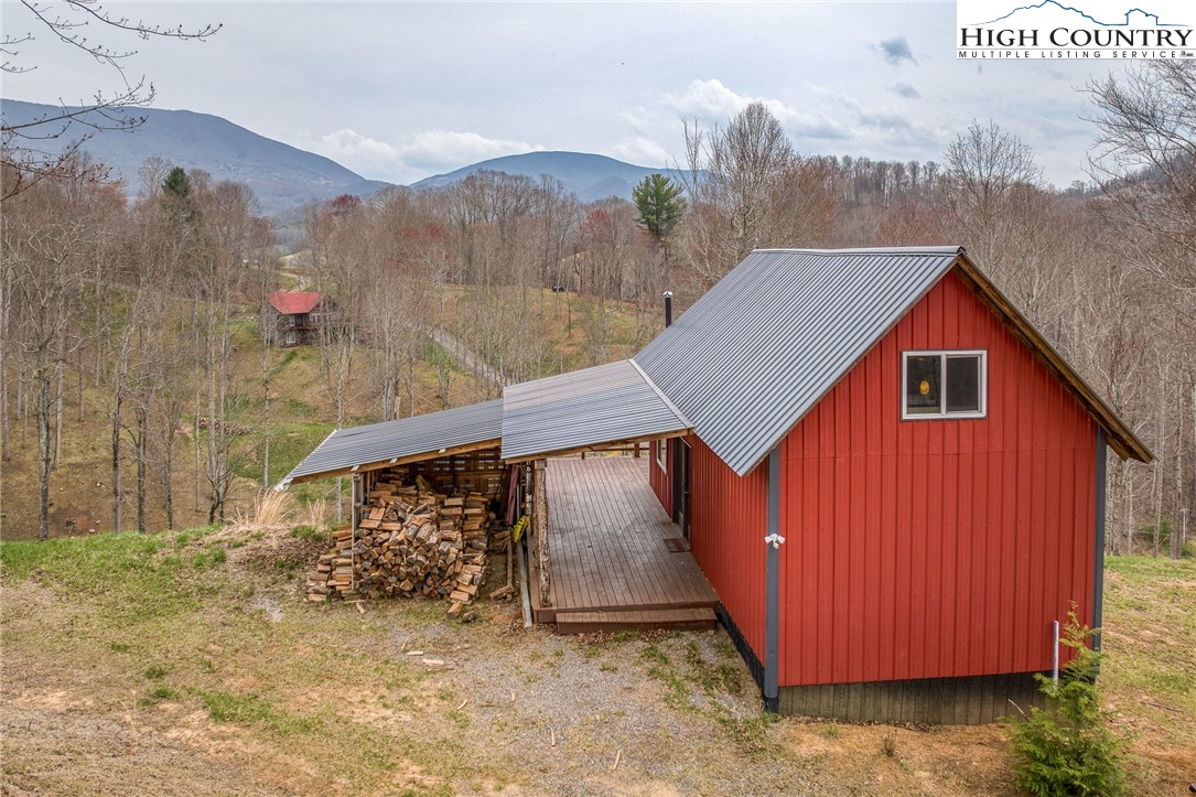 a view of a small house with a yard