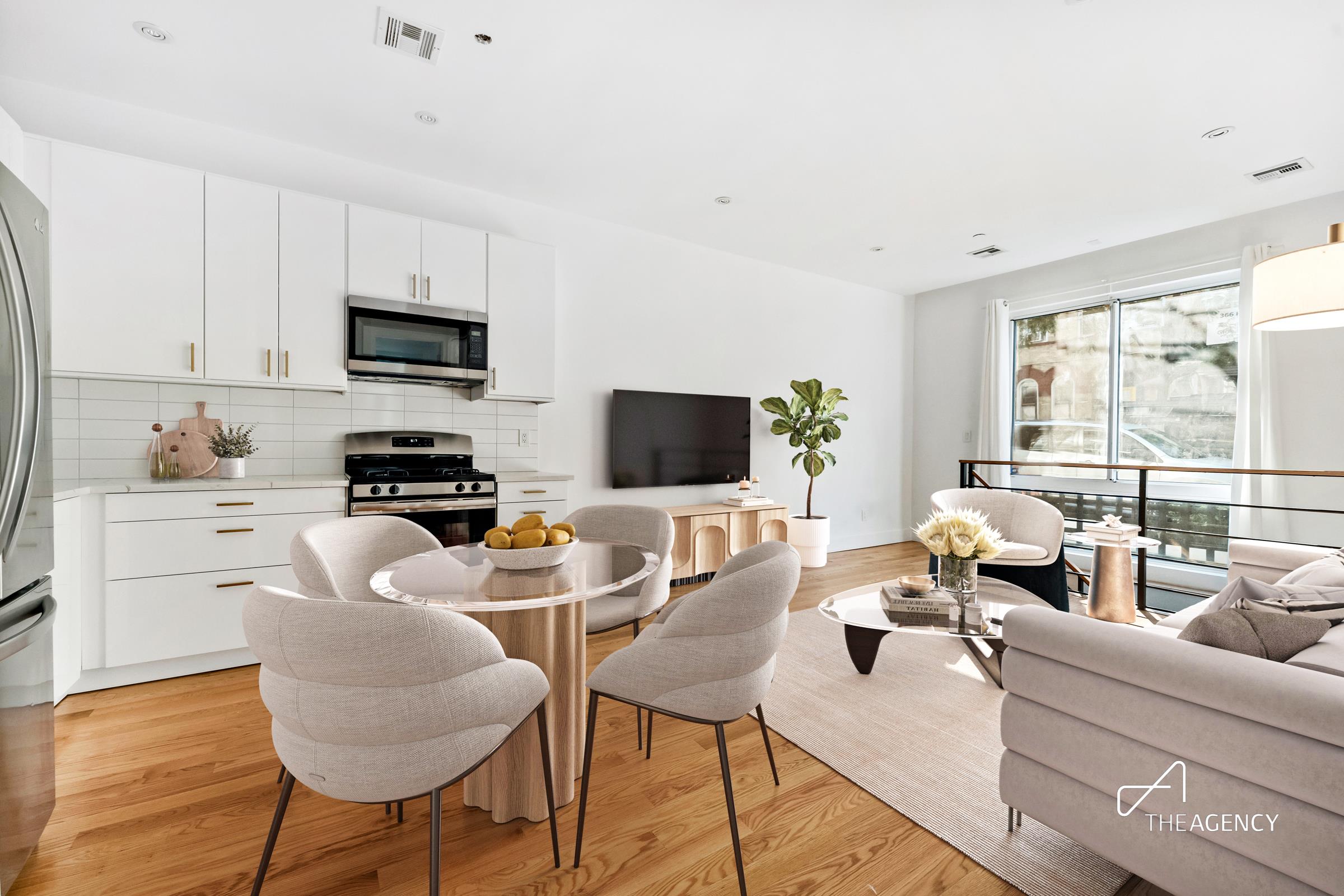 a living room with furniture a flat screen tv and a large window