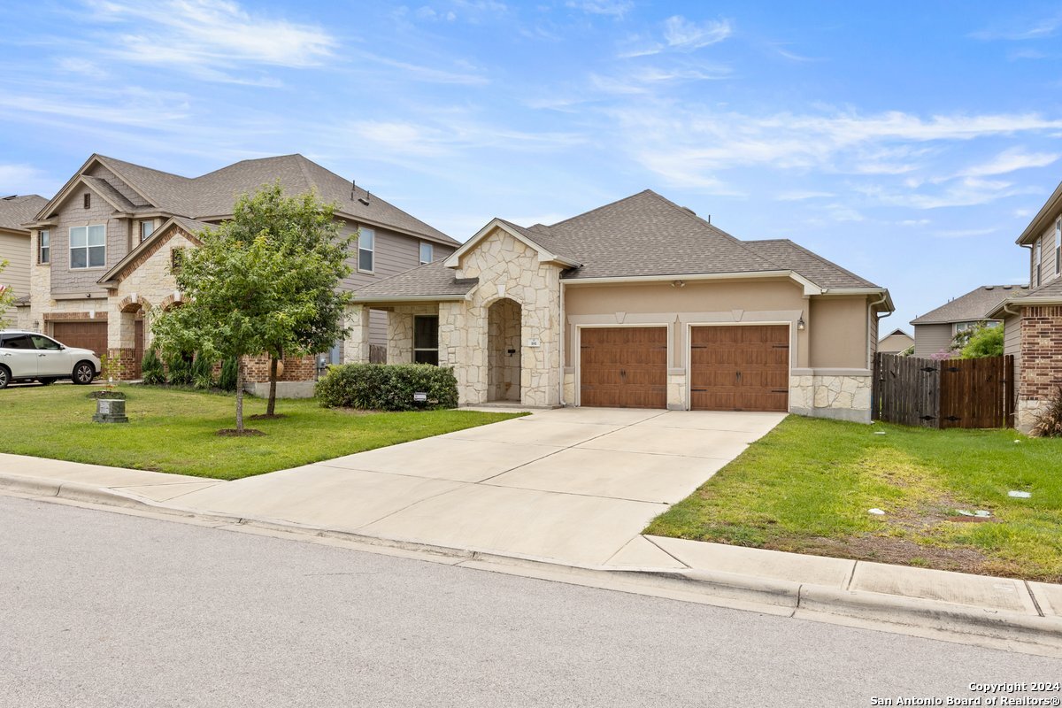 front view of a house with a yard