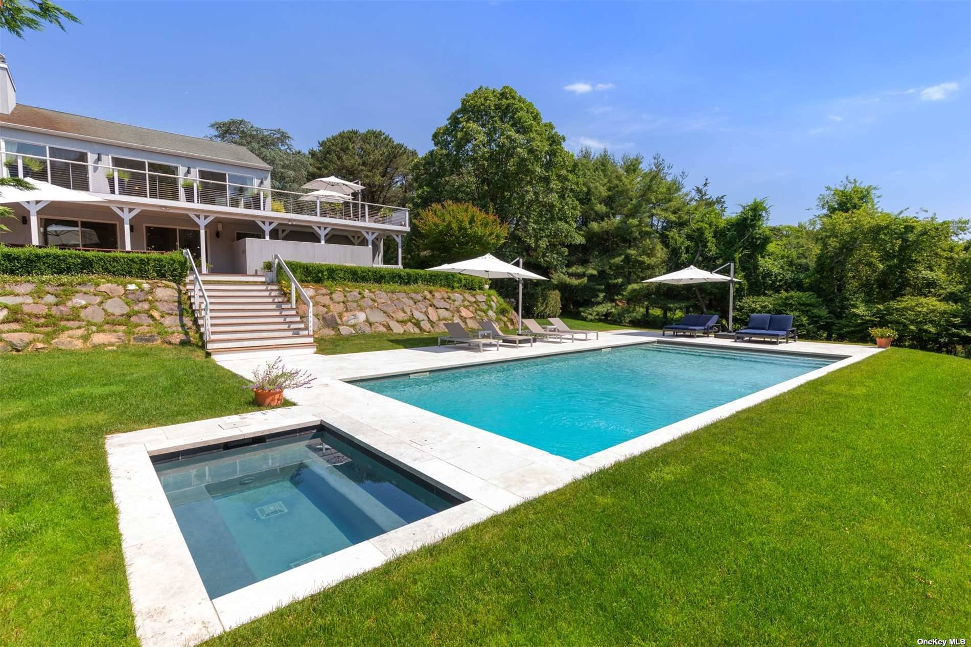 a view of an house with backyard space and sitting area