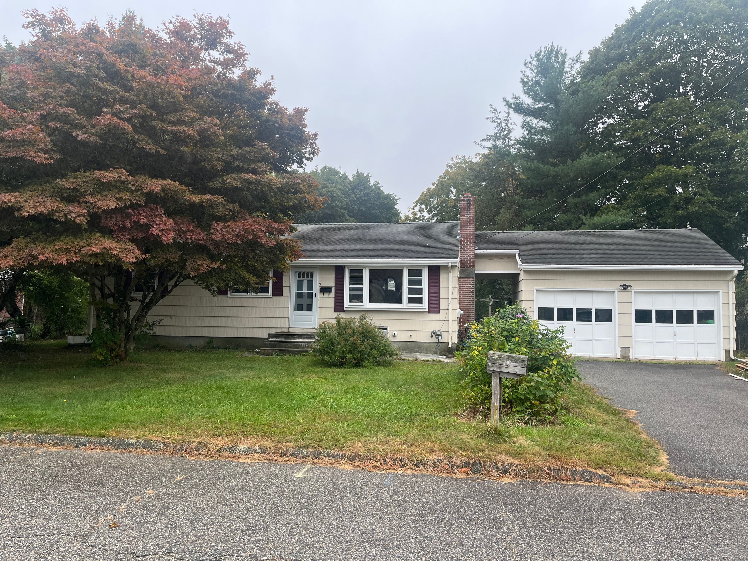 front view of a house with a yard