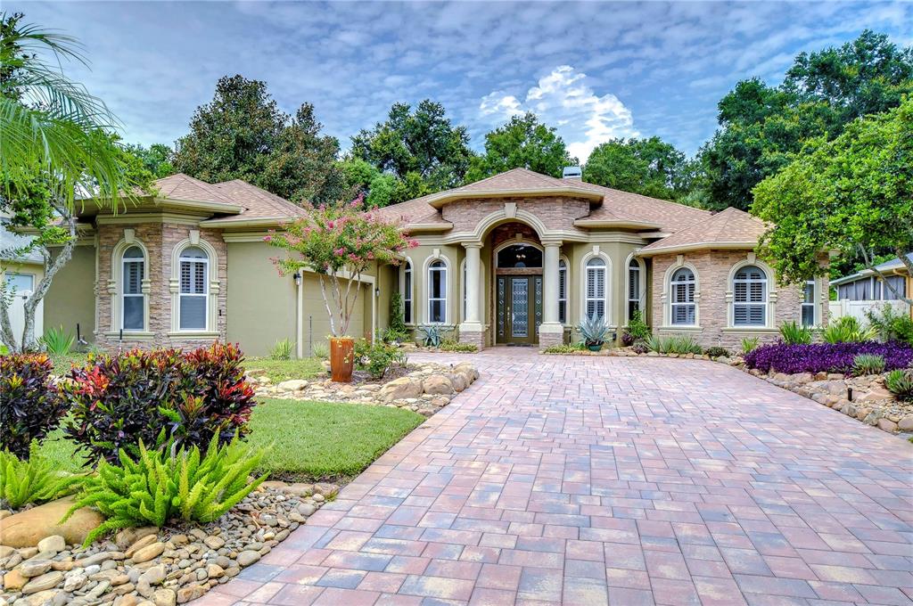 a front view of a house with garden