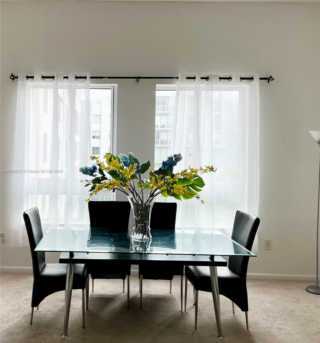 a dining room with furniture and window