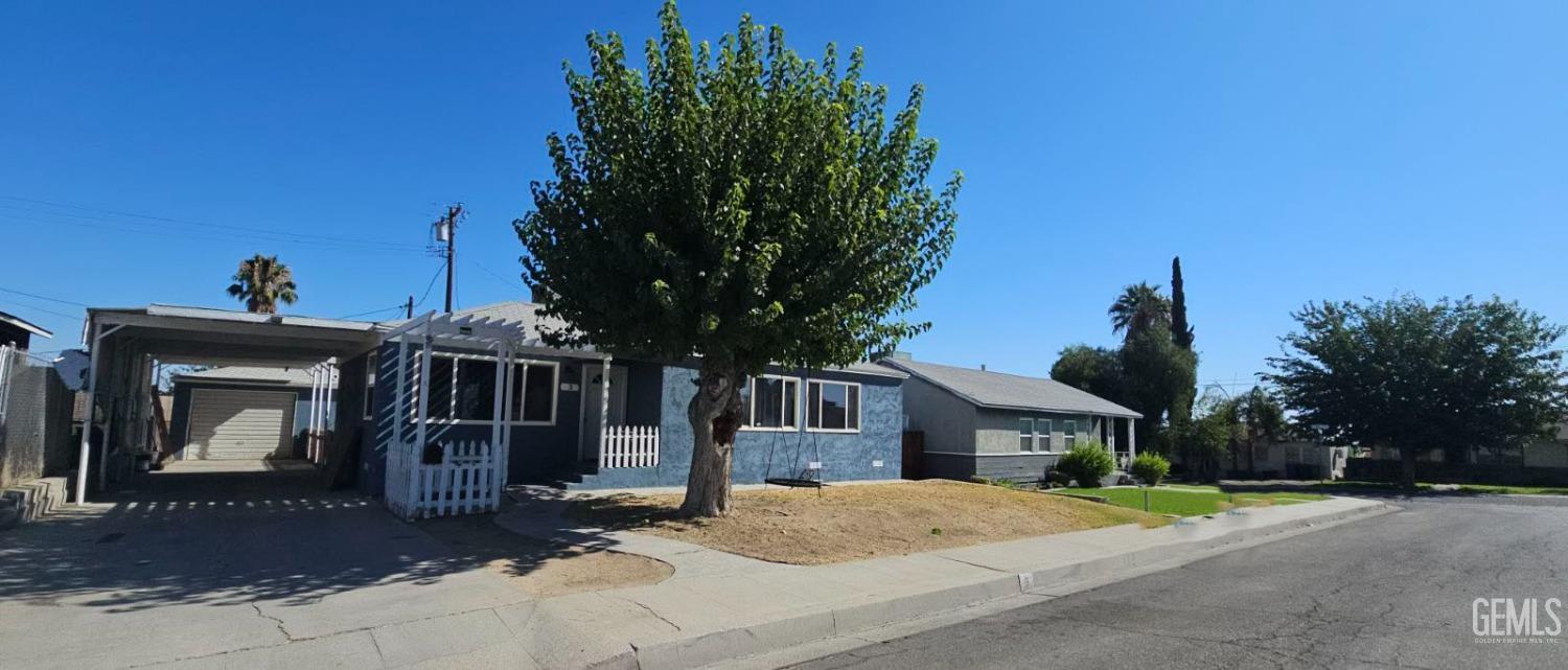 a house with tree in front of it