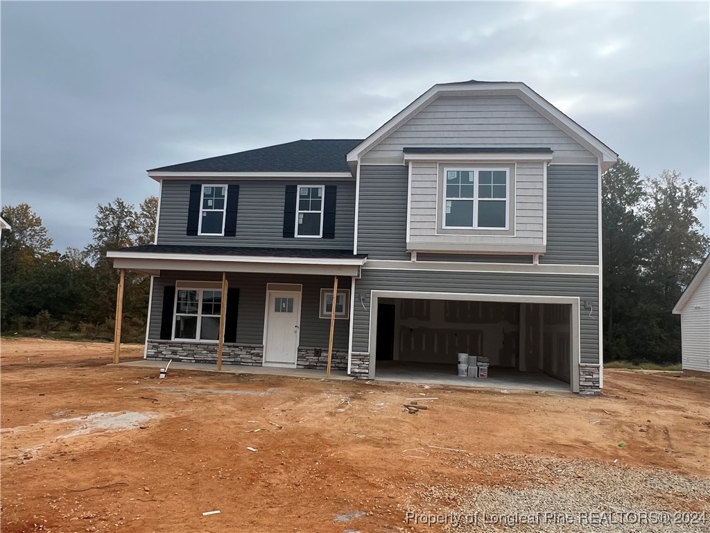 a front view of a house with a garage