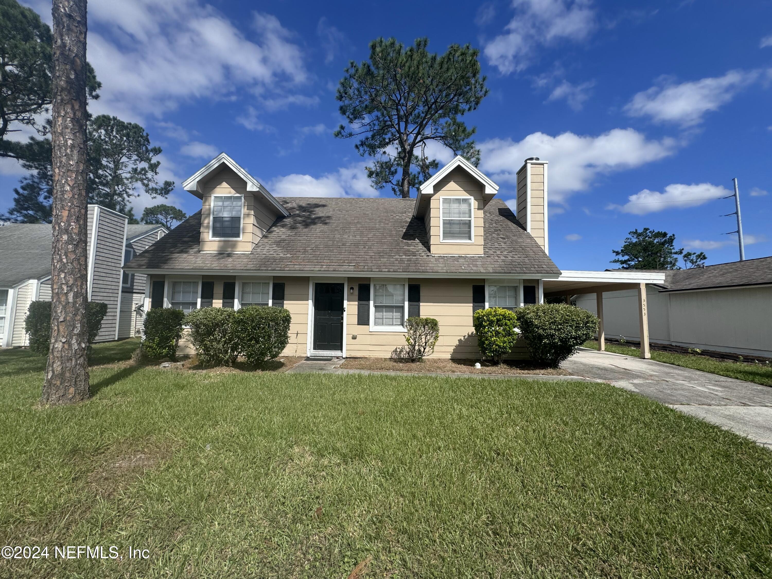 a front view of a house with a yard