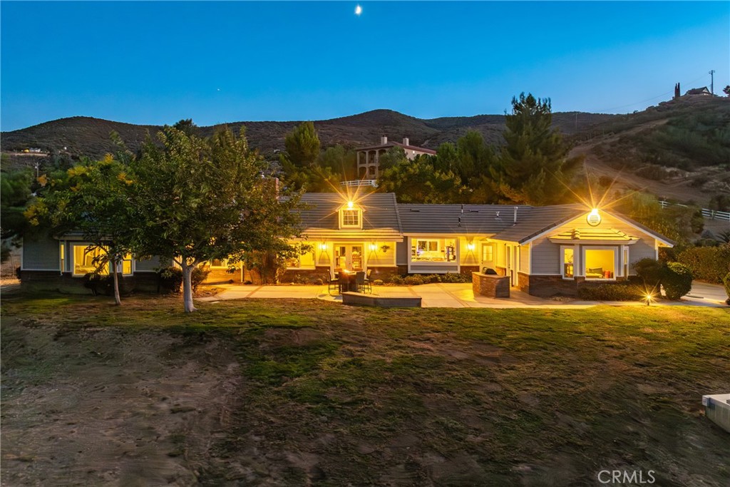 a view of a large house with a big yard