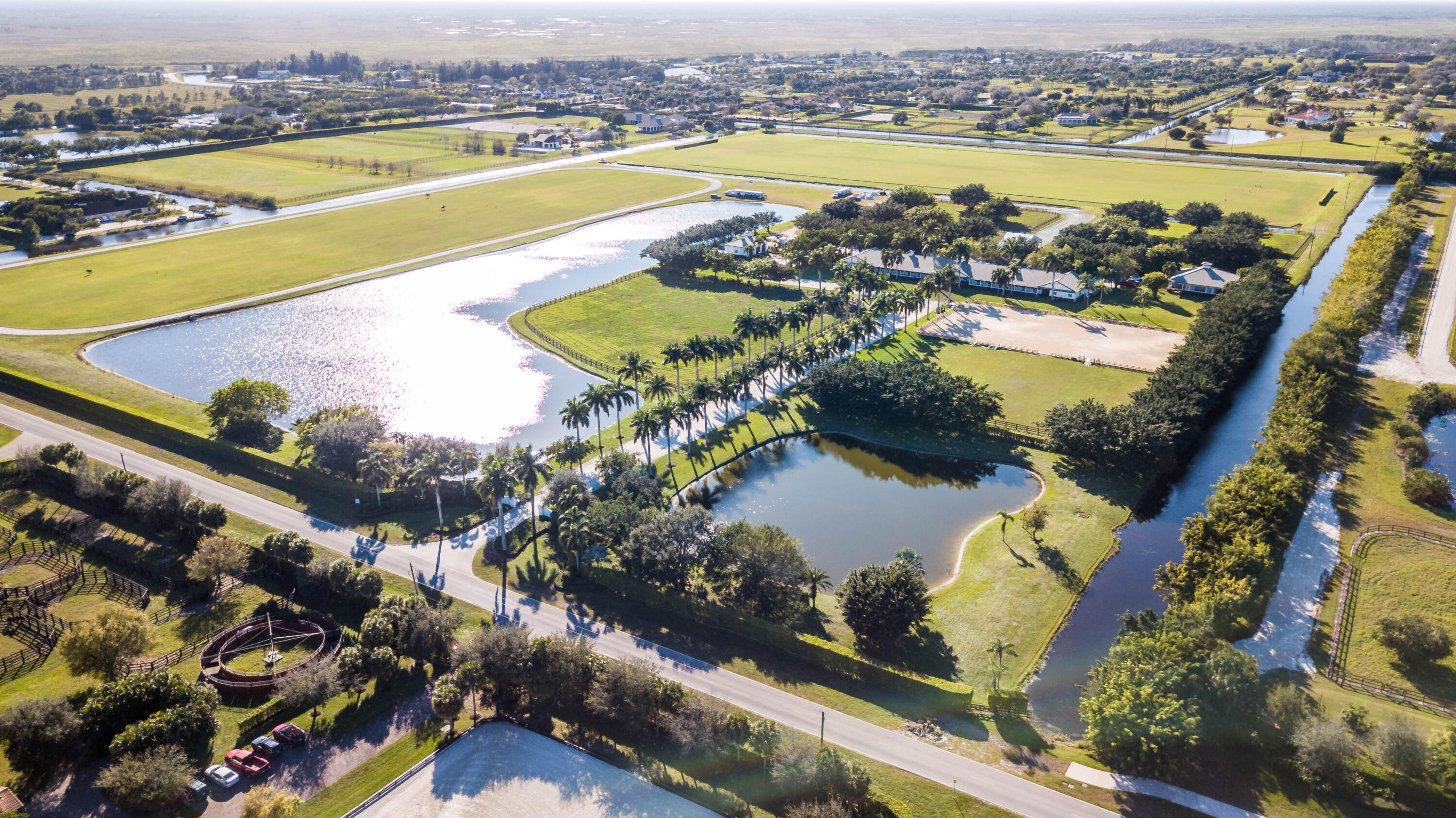 an aerial view of residential houses with outdoor space and swimming pool