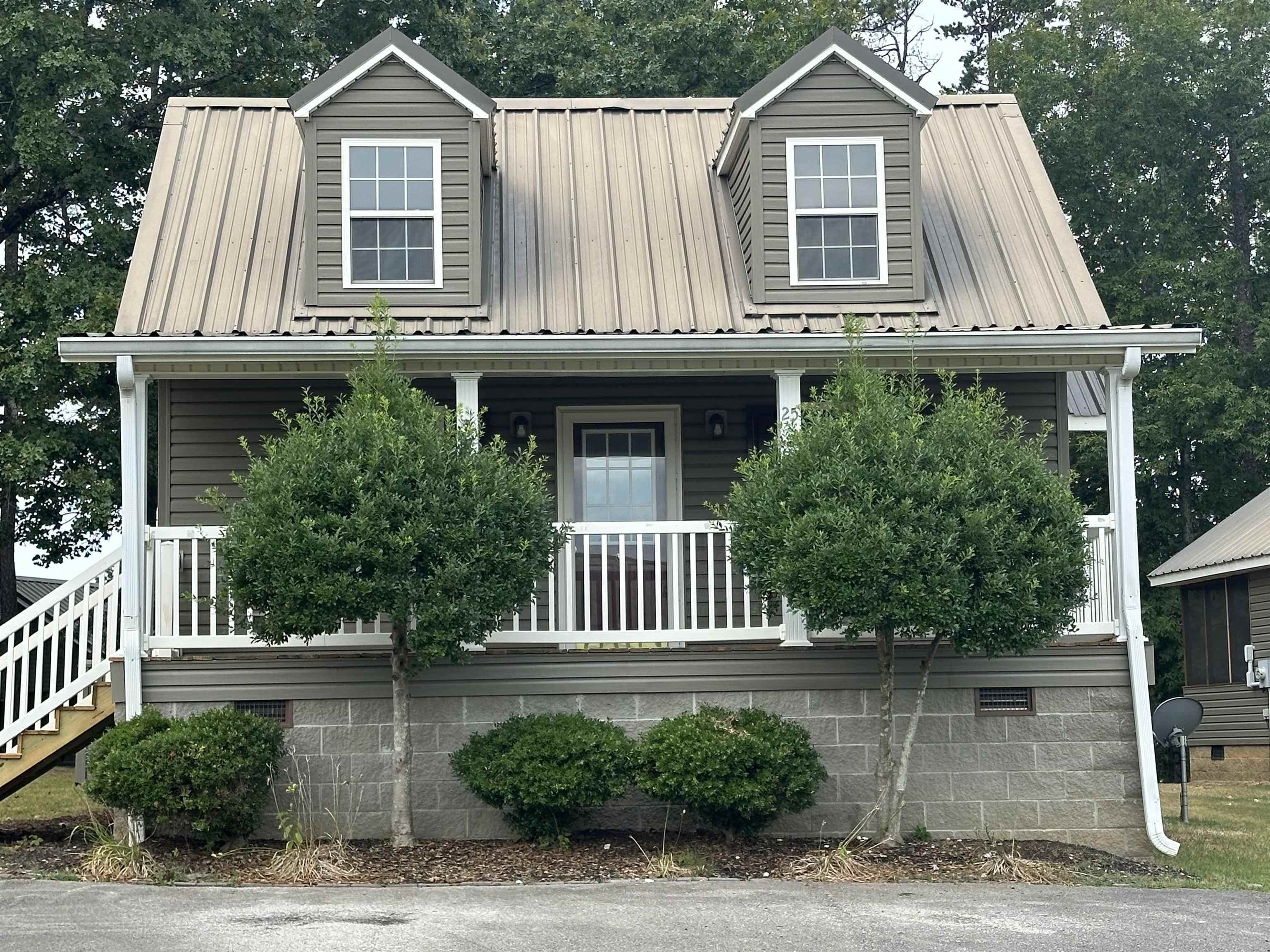 a front view of a house with a porch