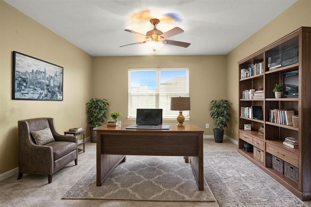 a living room with furniture lamps and a fireplace