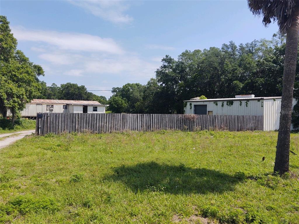 a view of a backyard with a small cabin