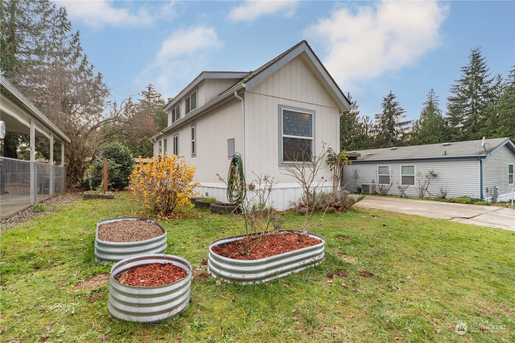 a house view with a garden space and outdoor seating