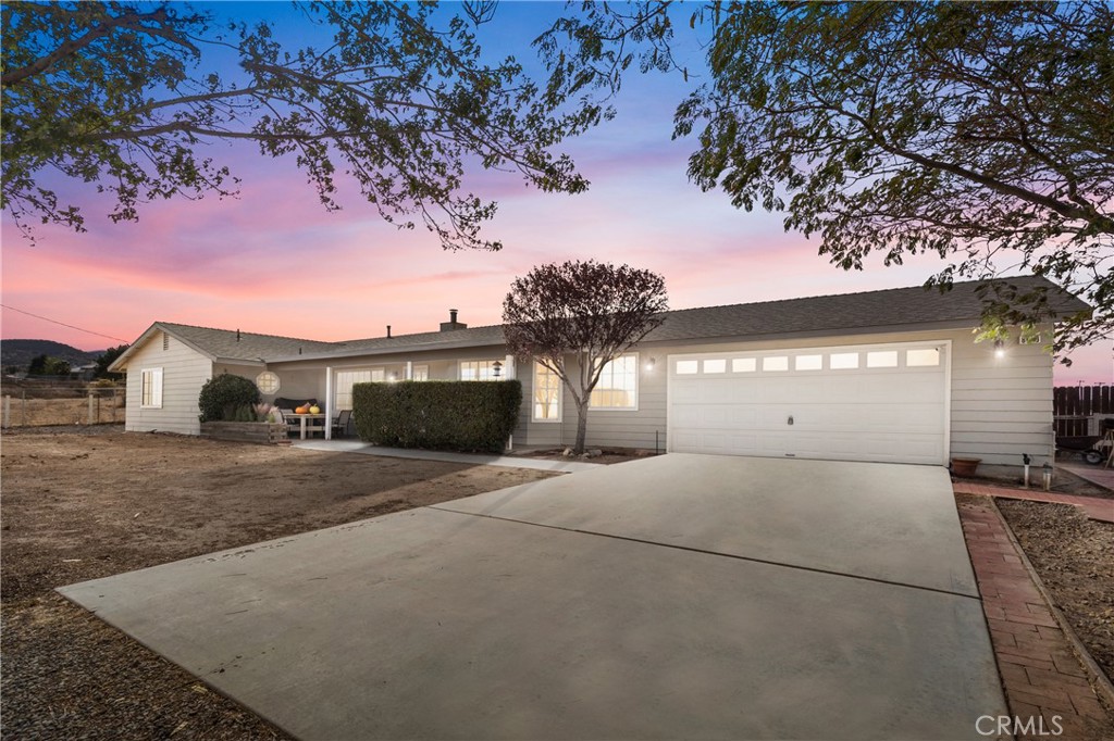 a view of a house with a tree