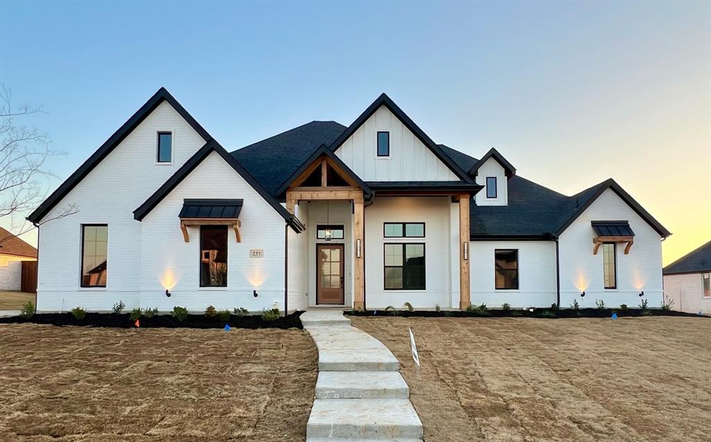 a front view of a house with yard