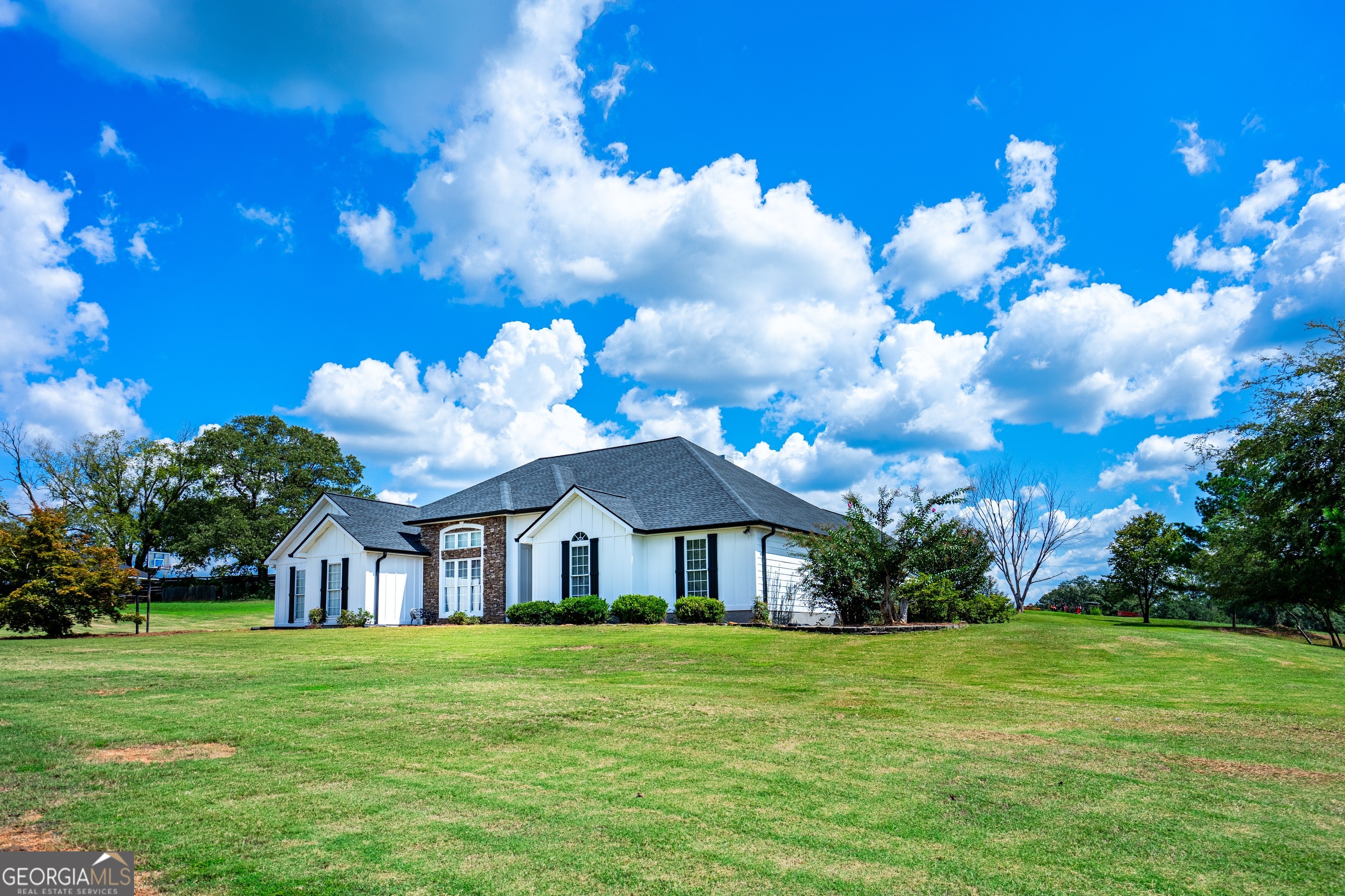 a front view of a house with garden