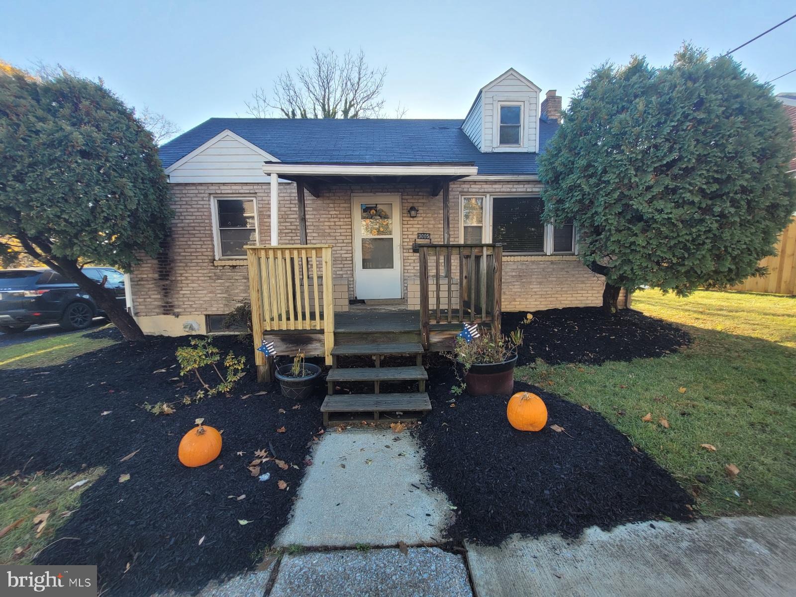 a front view of a house with yard