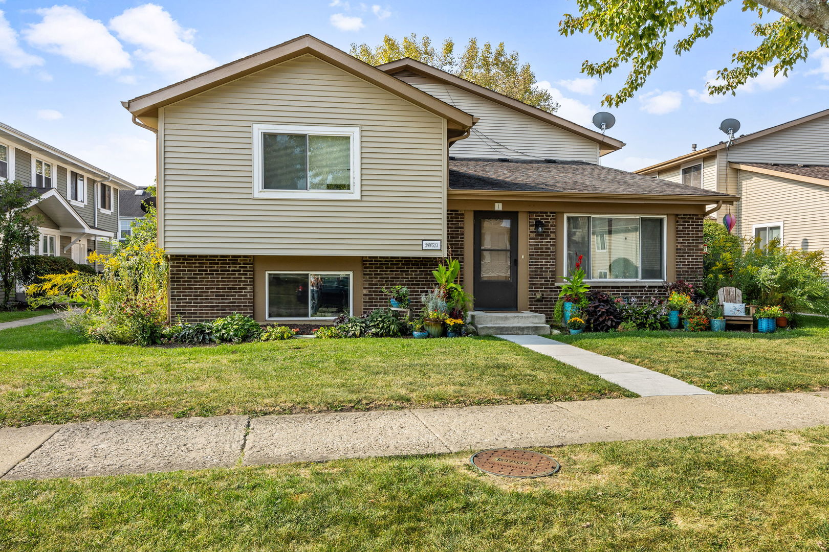 a view of a house with a yard and plants