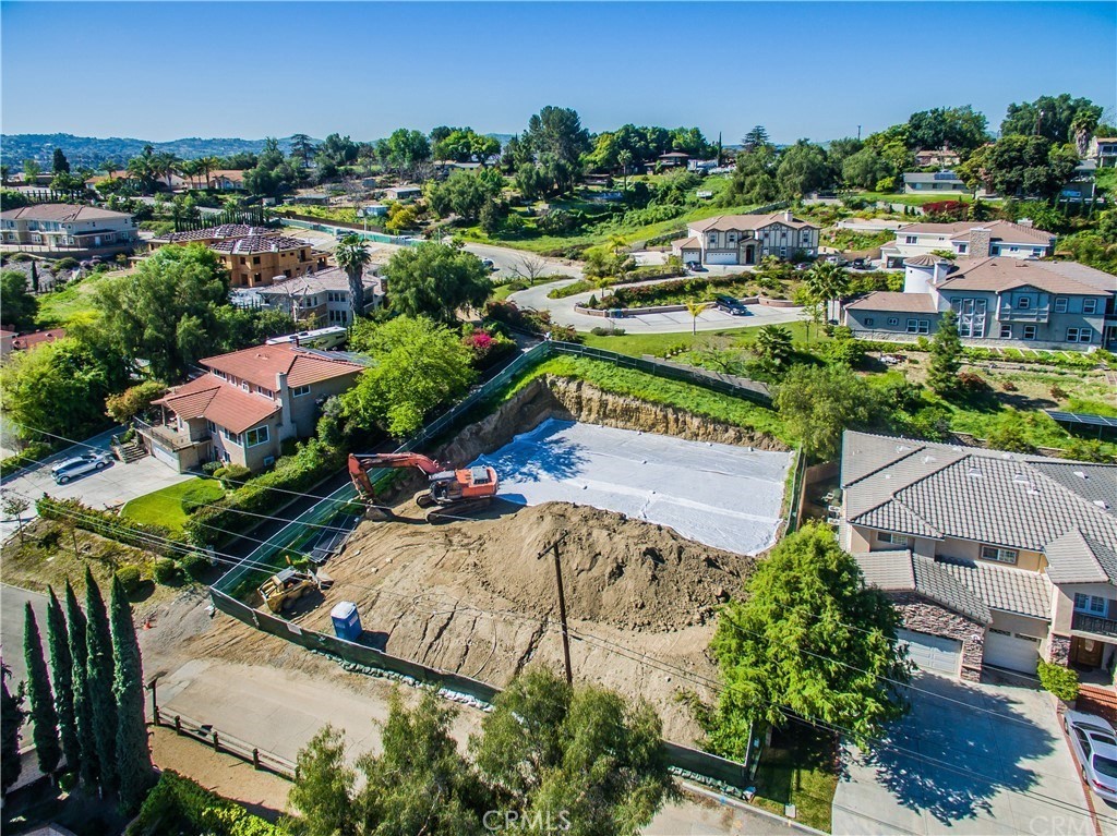 an aerial view of a house with yard swimming pool and outdoor seating