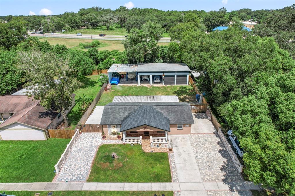 a aerial view of a house with a big yard