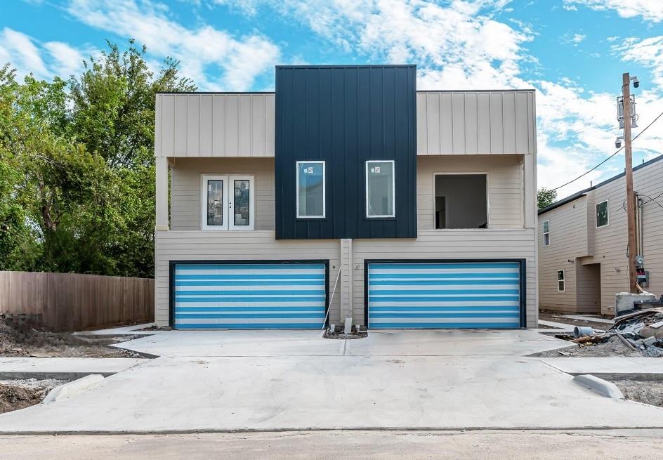 a front view of a house with a garage