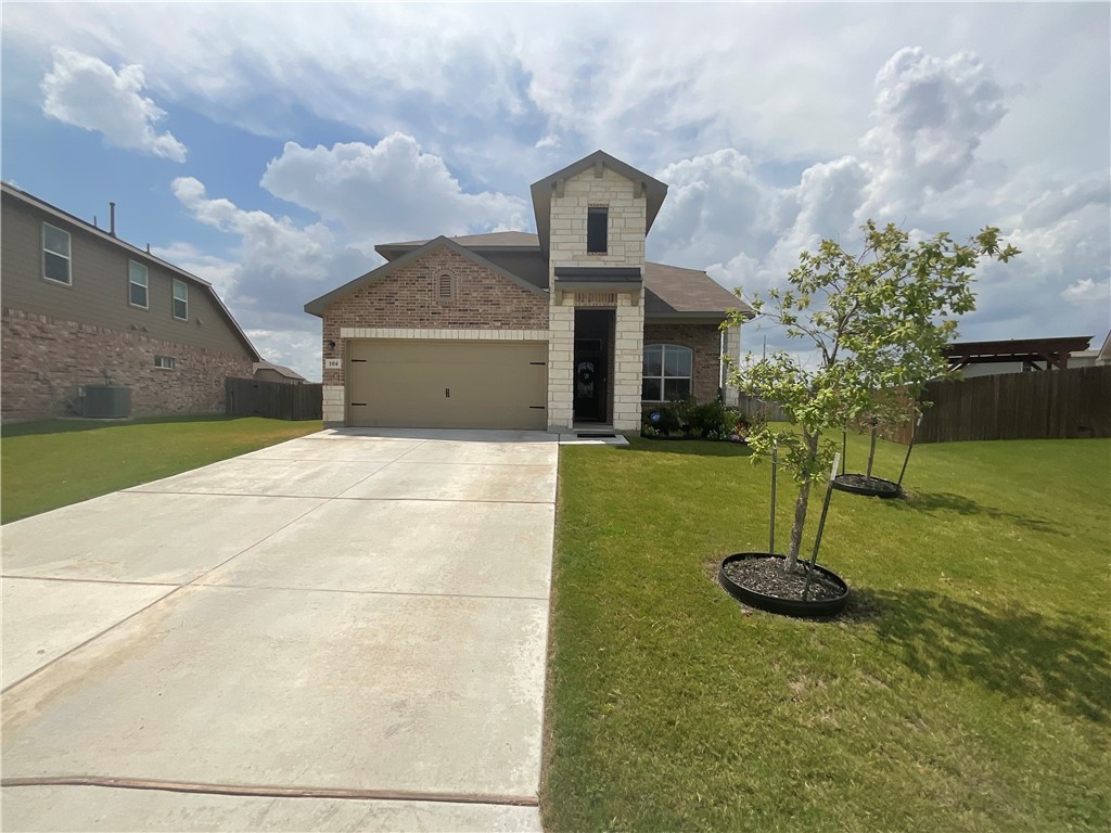 a front view of a house with yard