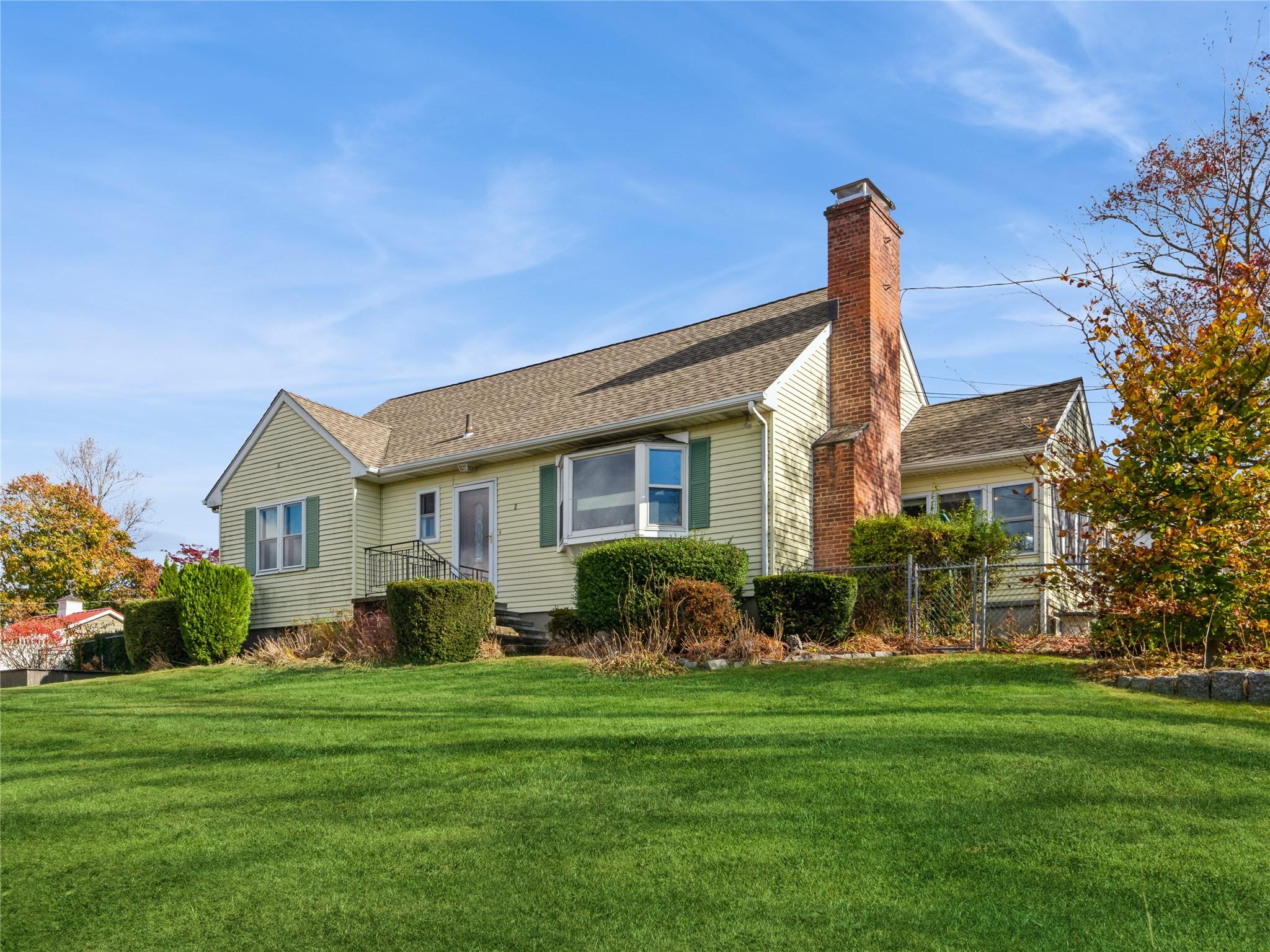 View of front facade with a front lawn