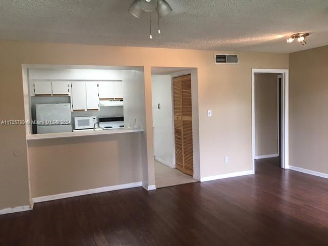 a view of kitchen with wooden floor