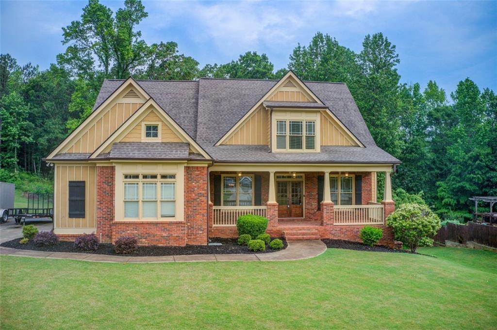 a front view of a house with a yard