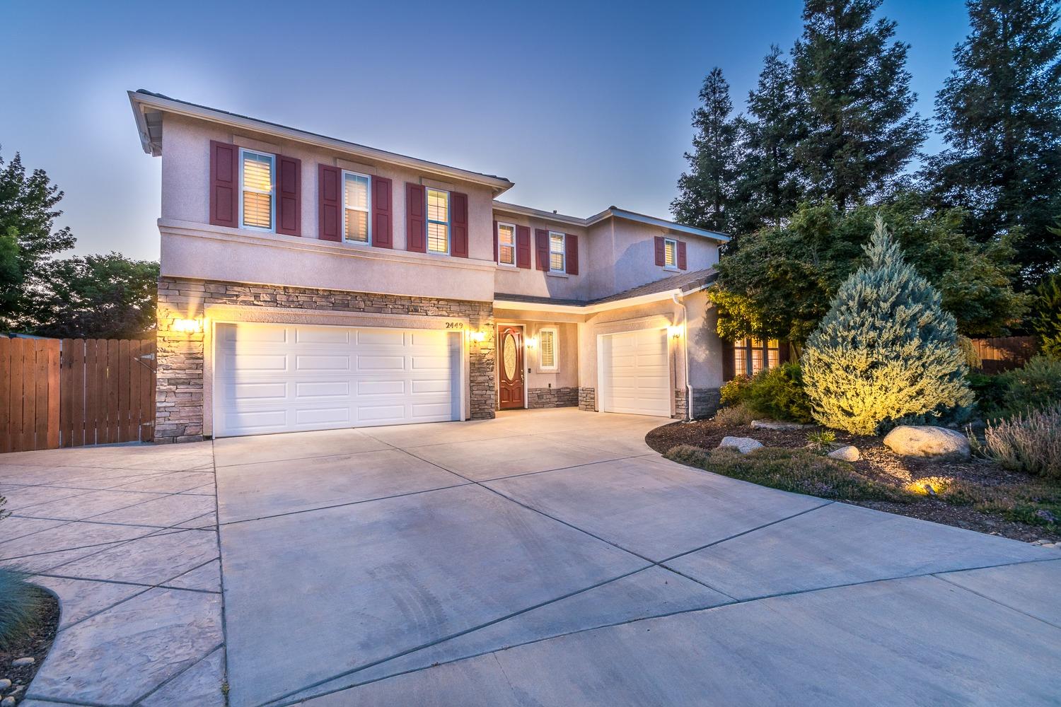 a view of a house with a yard and garage