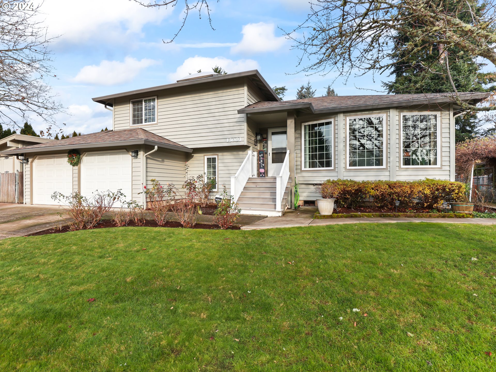 a front view of a house with a yard